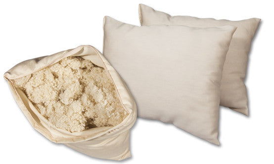 Natural wooly bolas pillow. Covered in a sateen fabric of organic cotton fibers.